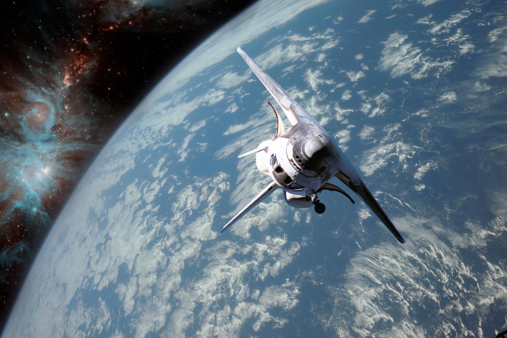 A spacecraft in orbit above Earth, representing the aerospace and space systems PPSI builds for